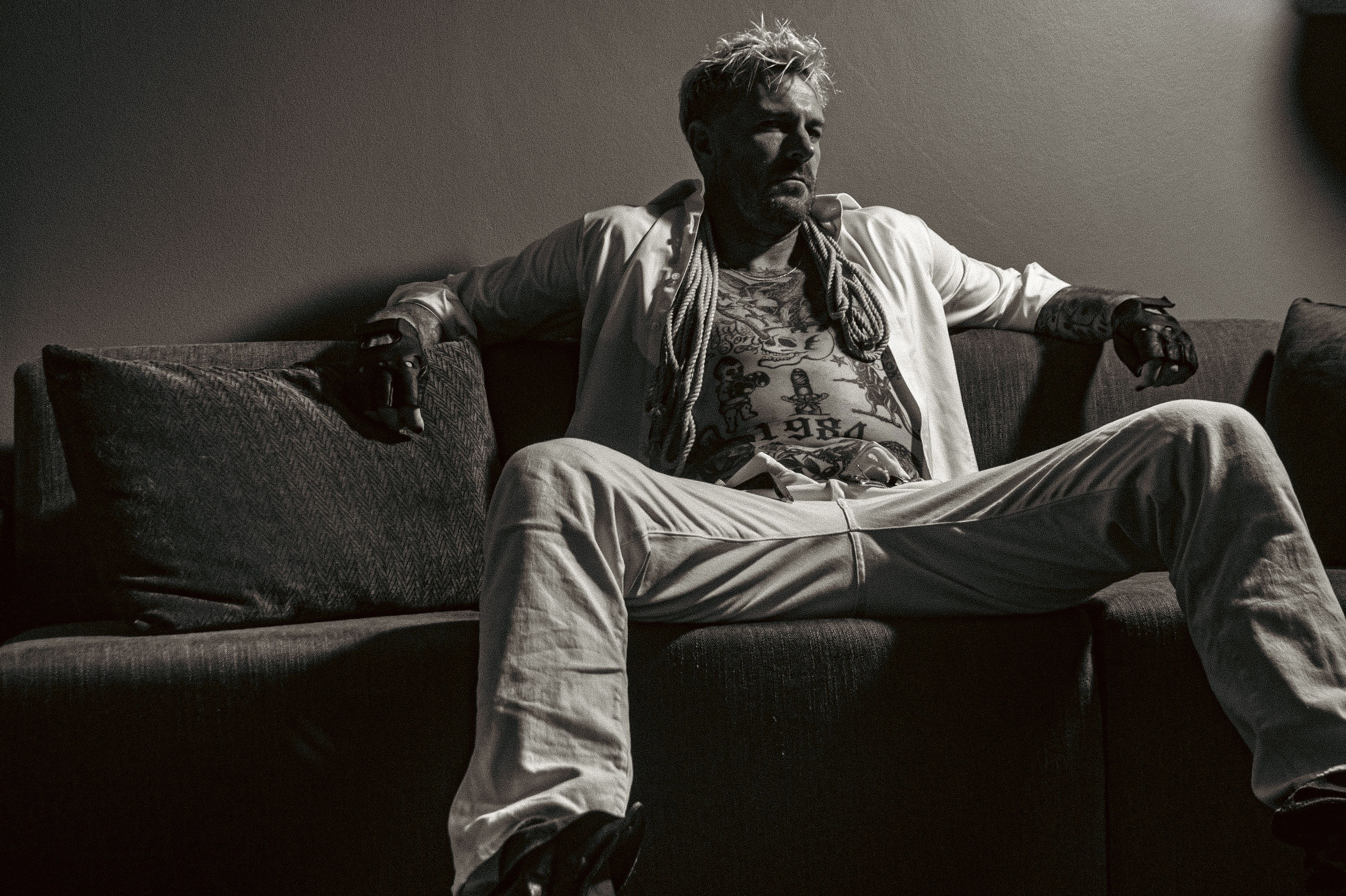 Kevin in a relaxed pose, subtle smile, soft background